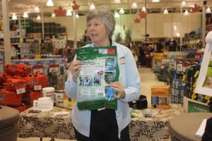 Zoe Kirk, water conservation ambassador with the Regional District of Okanagan-Similkameen, shows a rain barrel kit. (Keith Lacey photo)