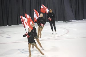 Members of the Sun Bowl Skating Club carry Canadian flags in last Thursday's Ice Show. The theme of the show was countries of the world. (Keith Lacey photo)