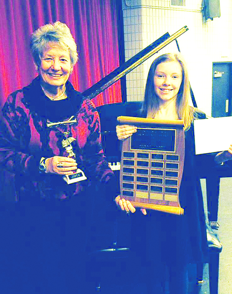 Sydney Hanson, 12, is the latest recipient of the Dorothy Fraser Memorial Award for her outstanding musical achievement. She was handed the award recently by Susan Whittaker, past-president of the Osoyoos & District Arts Council. (Photo supplied)