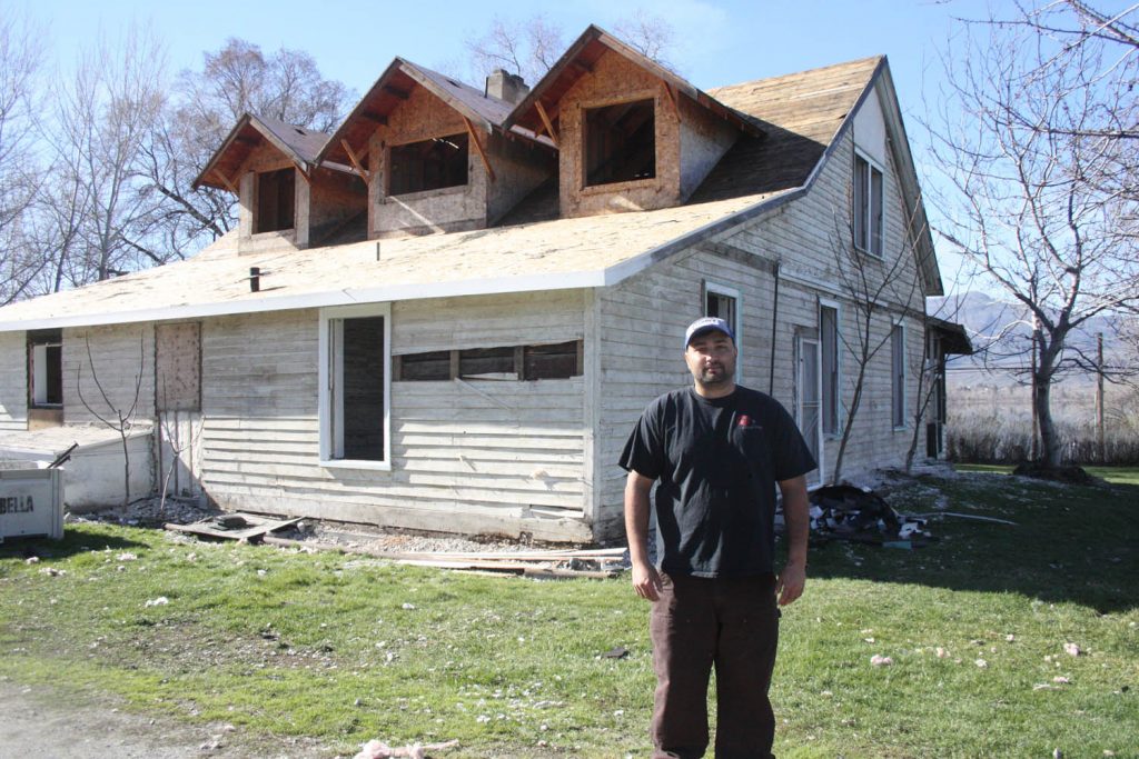 Ricky Dhaliwal stands at the back of the historic Haynes House, which has badly deteriorated and will be demolished next month. His parents bought the land and the family plans to develop a winery on the property. (Keith Lacey photo)