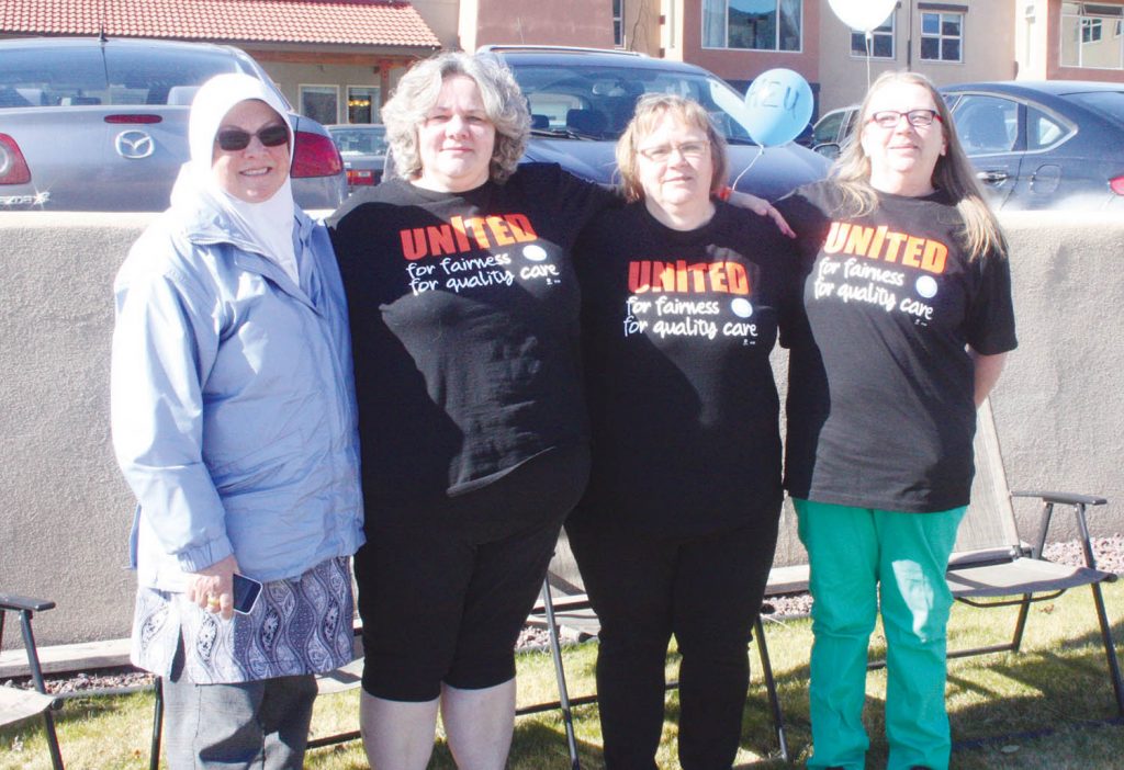 Unionized employees with the Hospital Employees’ Association (HEU) Mariposa Gardens held a community barbecue and awareness event last Friday outside the assisted living and residential care facility in Osoyoos. More than 120 unionized workers have been working without a contract since late November. The union will be demanding increased wages and reduced workload when contract negotiations continue on April 18. (From left) Debbie Kamal Ali, from HEU’s provincial office in Burnaby, residential care aide Sherri Davenport, chair of the union’s local bargaining committee, Tammy Garbutt and Sandy Tait, a residential care aide. (Keith Lacey photo)