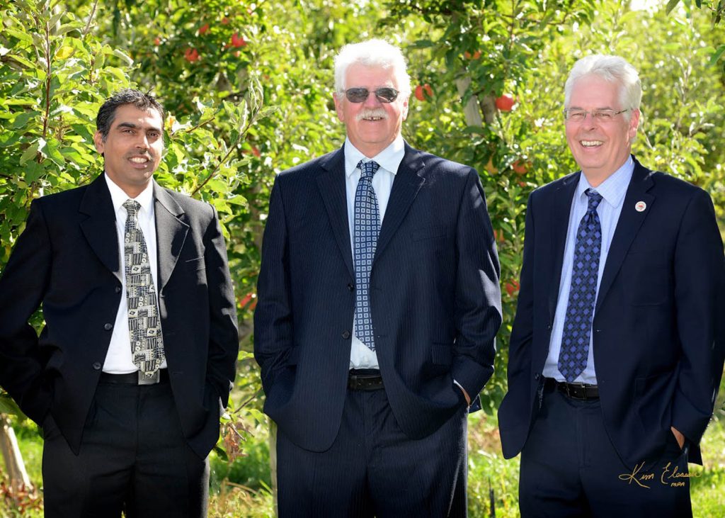 The BCFGA is concerned about the lack of information being provided to Canadian consumers after the Health Canada and the Canadian Food Inspection Agency approved the controversial Arctic Apple for sale in Canada. BCFGA president Fred Steele (centre) is shown with vice-president Pinder Dhaliwal (left) and general manager Glen Lucas. (Photo supplied)