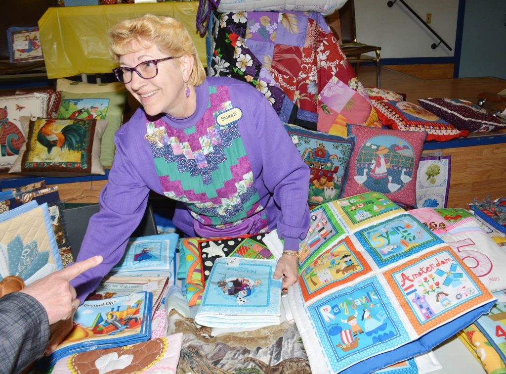 Susan Evans, a member of the Osoyoos Quilters, turned a lot of heads at the Kiwanis Club of Osoyoos Spring Craft Fair at the Osoyoos Legion on Saturday. Evans makes lovely quilts and pillows of all shapes and sizes, and even creates quilted picture books for children. (Lyonel Doherty photo)