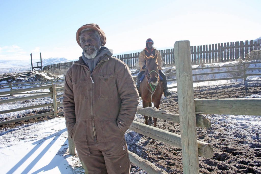Veteran trainer Lionel Joseph and his three sons (Kwame is seen riding in the background) are back in Osoyoos to train a large stable of horses at the Desert Park racetrack and training facility to get ready for the race season at Northlands Racetrack in Edmonton. Joseph’s passion from horses began as a child in his native Antigua. (Keith Lacey photo)