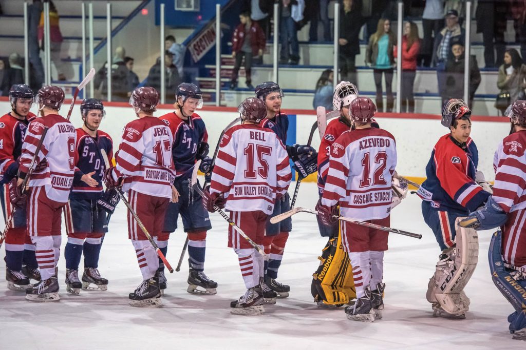 The Kamloops Storm and Osoyoos Coyotes meet at centre ice to offer each other congratulations on a well-played series as the Coyotes once again were eliminated from the playoffs in the conference finals. (Richard McGuire photo)