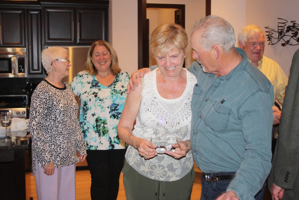 An emotional Linda Larson is congratulated by supporters as she takes in the news of her re-election victory. (Keith Lacey photo)