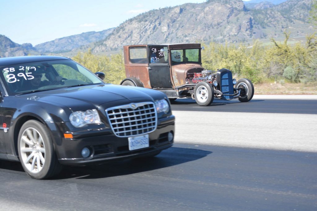 Luke Campbell from Summerland, in a 2006 Chrysler 300, takes on Enza Emmerson from Merritt in a rusty 1927 Model T. (Lyonel Doherty photo)