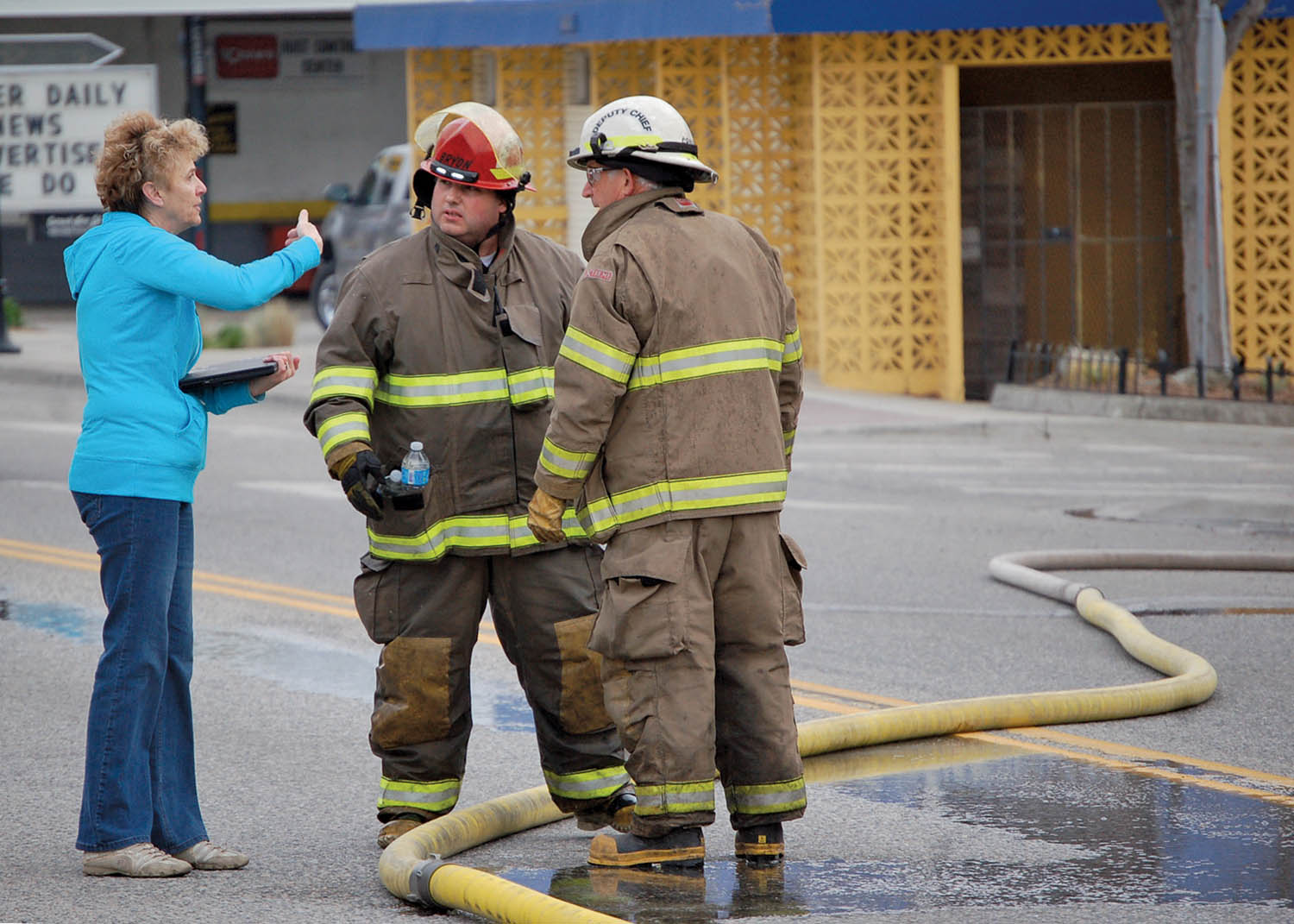 Local MLA Linda Larson talked to volunteer firefighters from Oliver after a fire caused significant damage to her Main Street office three weeks ago. The fire started in a house adjacent to Larson’s office and quickly spread. Larson and her staff have been coping well since the fire. (Lyonel Doherty file photo)
