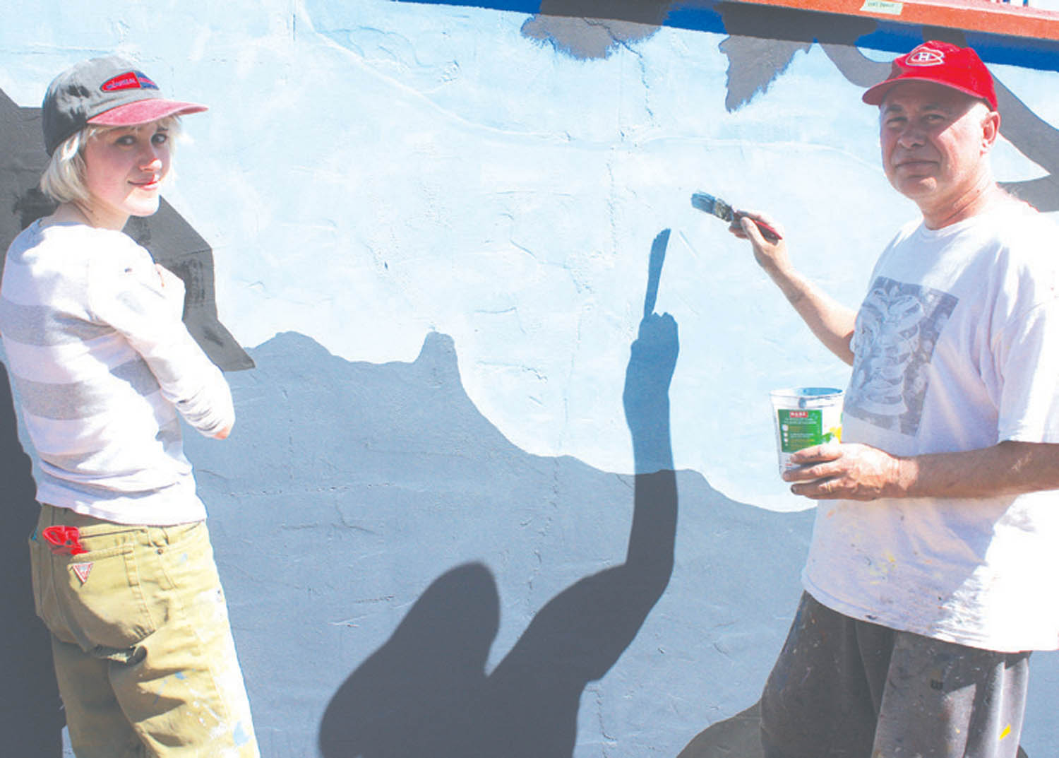 Acclaimed Penticton artist Glenn Clark was joined by his daughter Colette last week as they repainted the large mural located inside the Rattlesnake Canyon amusement park in Osoyoos. Clark’s artwork can be seen across many parts of the South Okanagan. (Keith Lacey photo)