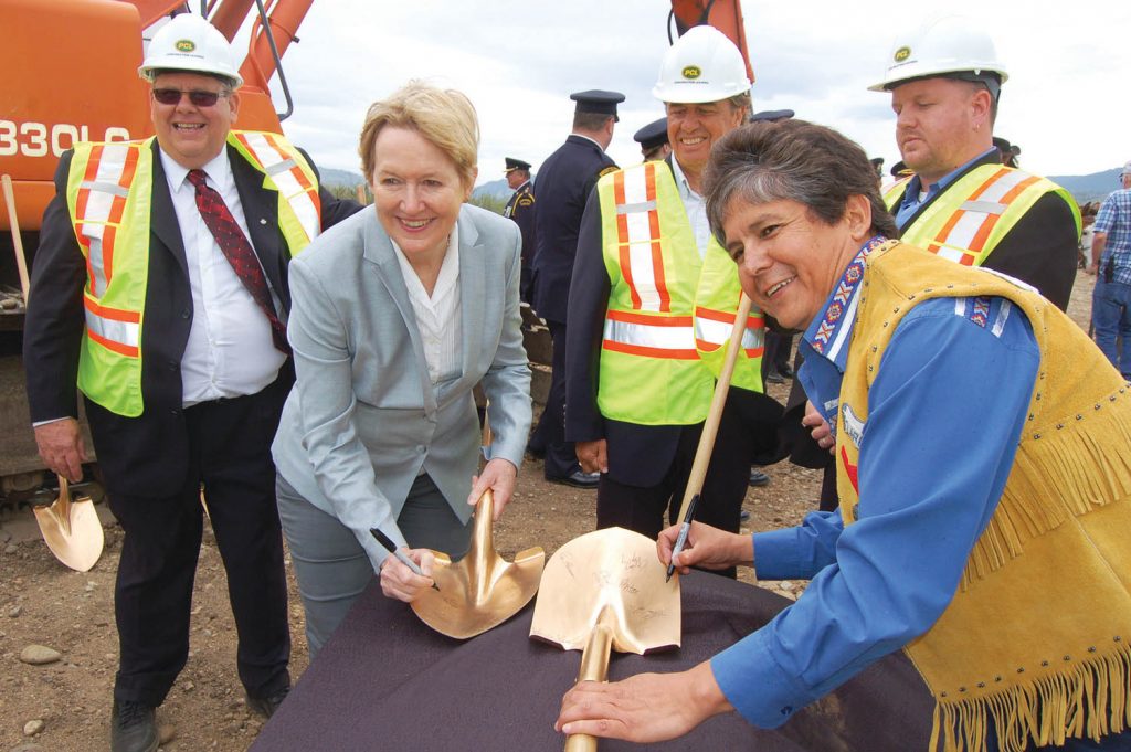 Osoyoos Indian Band Chief Clarence Louie joins Minister of Justice Suzanne Anton in signing the ceremonial shovels used in the sod turning at the Okanagan Correctional Centre site in Senkulmen Business Park last Friday. Looking on are Deputy Provincial Director of BC Corrections Tedd Howard (left), Penticton Mayor Garry Litke (middle) and South Okanagan Chamber of Commerce vice-president Brian Highley. (Lyonel Doherty photo) 