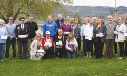 More than a dozen community groups and organizations pick up cheques from town