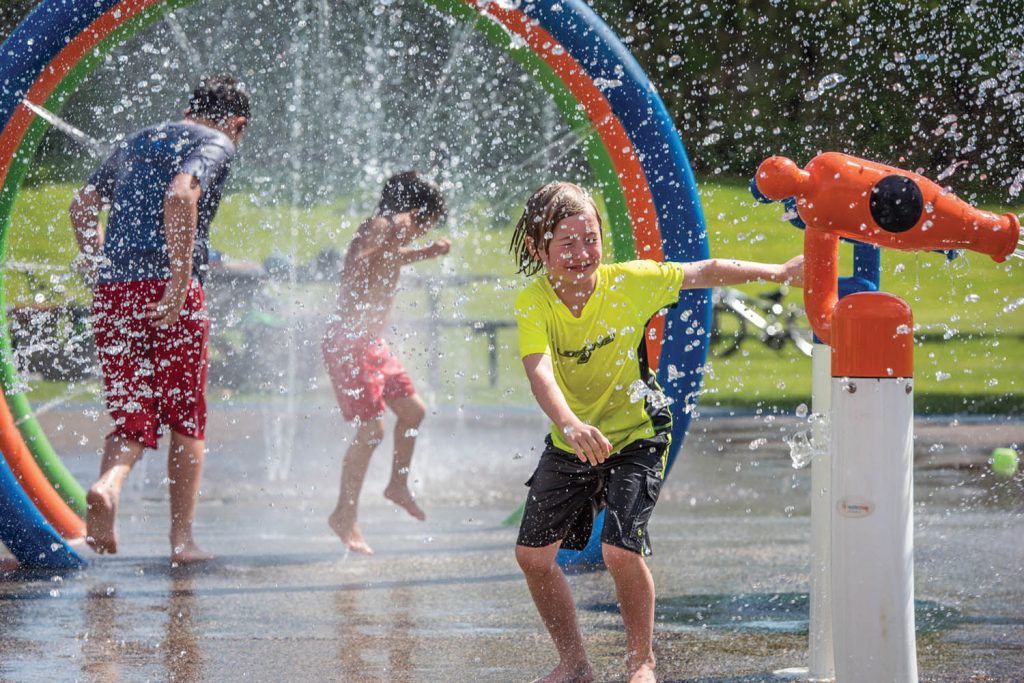 As temperatures climbed into the 30s in May, the Osoyoos Splash Park was a popular spot for kids of all ages. Finn Collins, 8, at right braces for spray before firing a water cannon. Collins, from Seattle, was visiting Osoyoos for the U.S. Memorial Day long weekend. The splash park opened for the season just prior to Canada's May Long weekend a week earlier. (Richard McGuire photo)