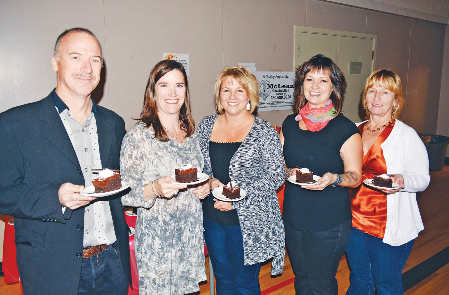 Board members with the Osoyoos Child Care Centre had their cake and ate it too at the third annual Harvest Dinner Dance at the Sonora Community Centre this past Saturday evening. From left are Trevor Leigh, Karen Hawitt, Stephanie Blaine, Kirsten McLean and Karen Greig (centre manager). The event was a fundraiser for the centre, but partial proceeds went to Osoyoos Secondary School dry grad and the Osoyoos Royalty program. (Lyonel Doherty photo)
