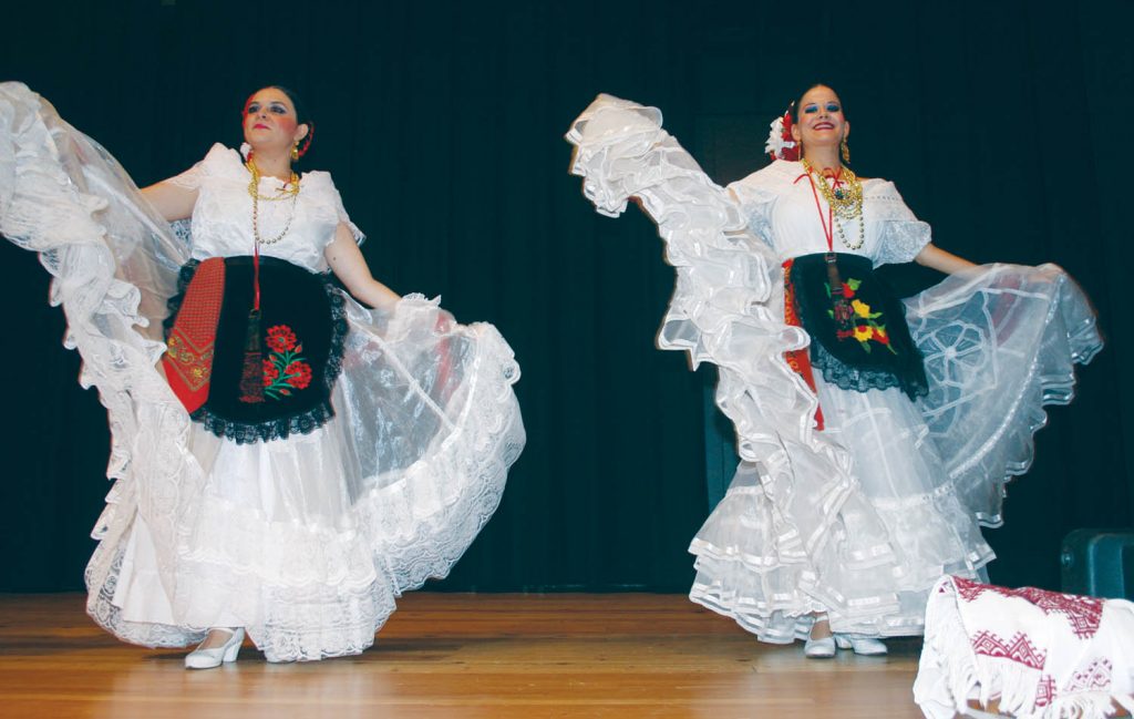 Two members of the Mexican dance ensemble Caudillos del Sur performed at the Sonora Community Centre Saturday during the Harvesting Diversity event organized by the South Okanagan Chamber of Commerce. The event celebrated the food, dance and music of several immigrant and First Nations cultures that have played important roles in local agriculture. (Keith Lacey photo)