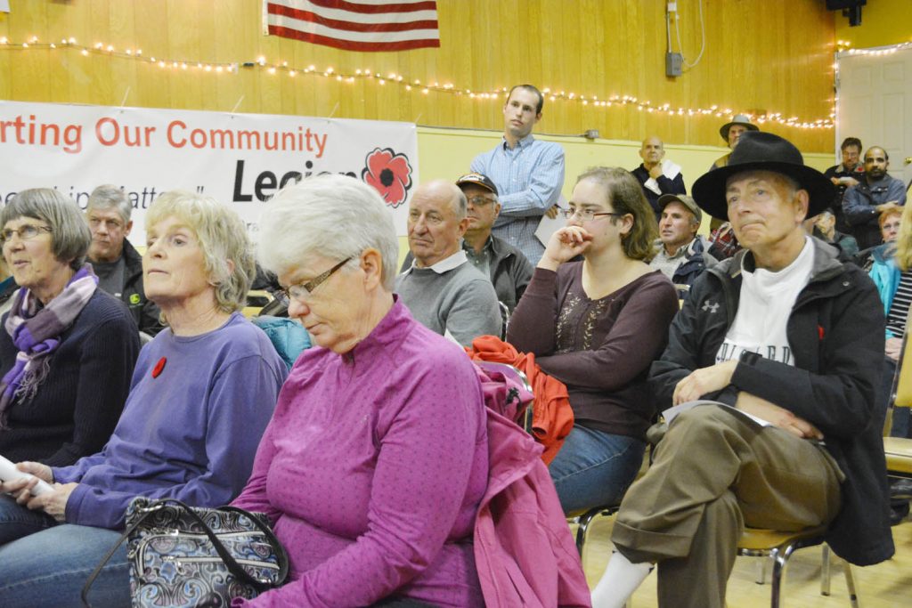 People listen while area fruit grower David Machial outlines his concerns about the KVR trail proposal during the recent meeting in the Oliver Legion hall. The majority of landowners who attended indicated they did not want the trail opened up in their backyard. (Lyonel Doherty photo)