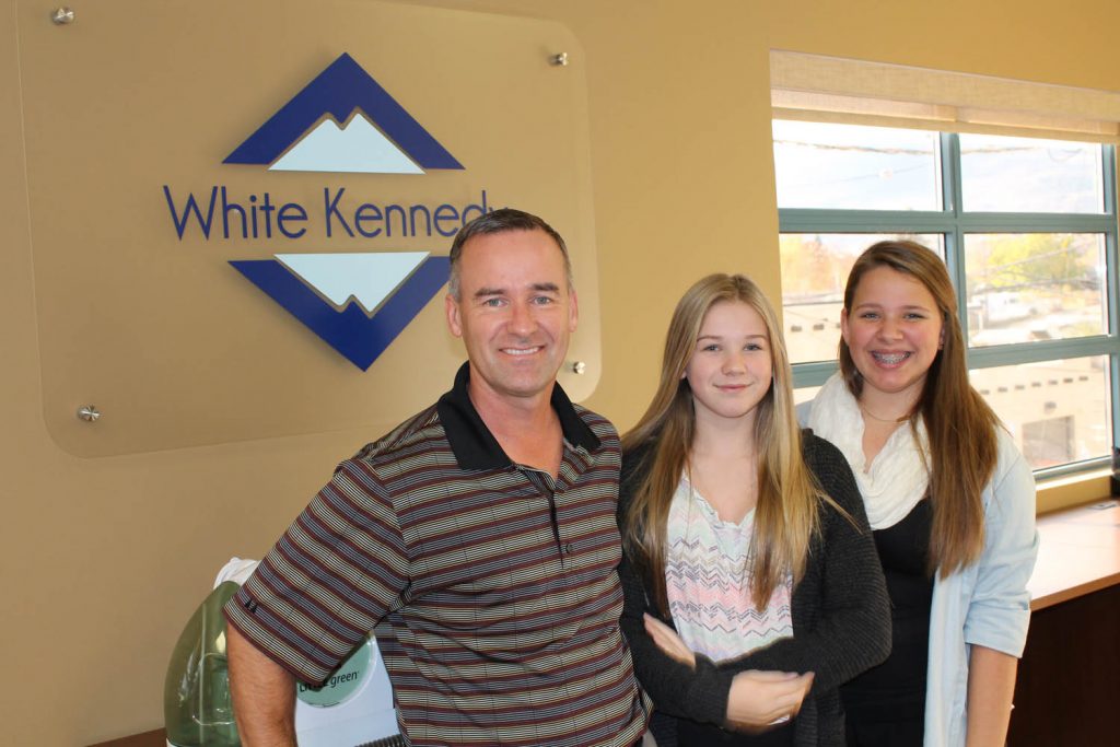 Jeff Duguid, a partner with White Kennedy chartered accountants in Osoyoos, invited his daughter Holly Duguid and her friend Rheanna Harfman to visit him at work during the recent Take Our Kids to Work program sponsored by School District 53. Grade 9 students from Osoyoos Secondary School and Southern Okanagan Secondary School in Oliver took part in this year’s program. (Photo supplied)