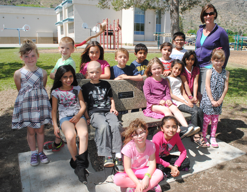 New bench at Oliver Elementary School honours late Principal Barton Tumlinson