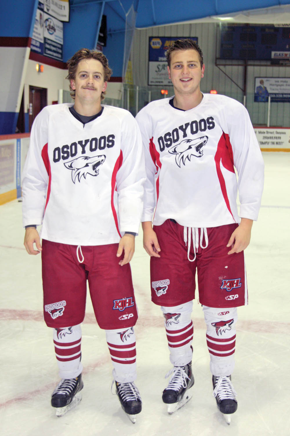 Troy Maclise (left) and Aaron Azevedo are thrilled to have been named co-captains of the Osoyoos Coyotes for the 2014-15 KIJHL season. While very good friends on and off the ice, Maclise and Azevedo couldn’t be more different as Maclise is Canadian, while Azevedo is American. Maclise is small and fast, while Azevedo is big and strong. Maclise leads by example, while Azevedo is the team’s vocal leader. (Keith Lacey photo)