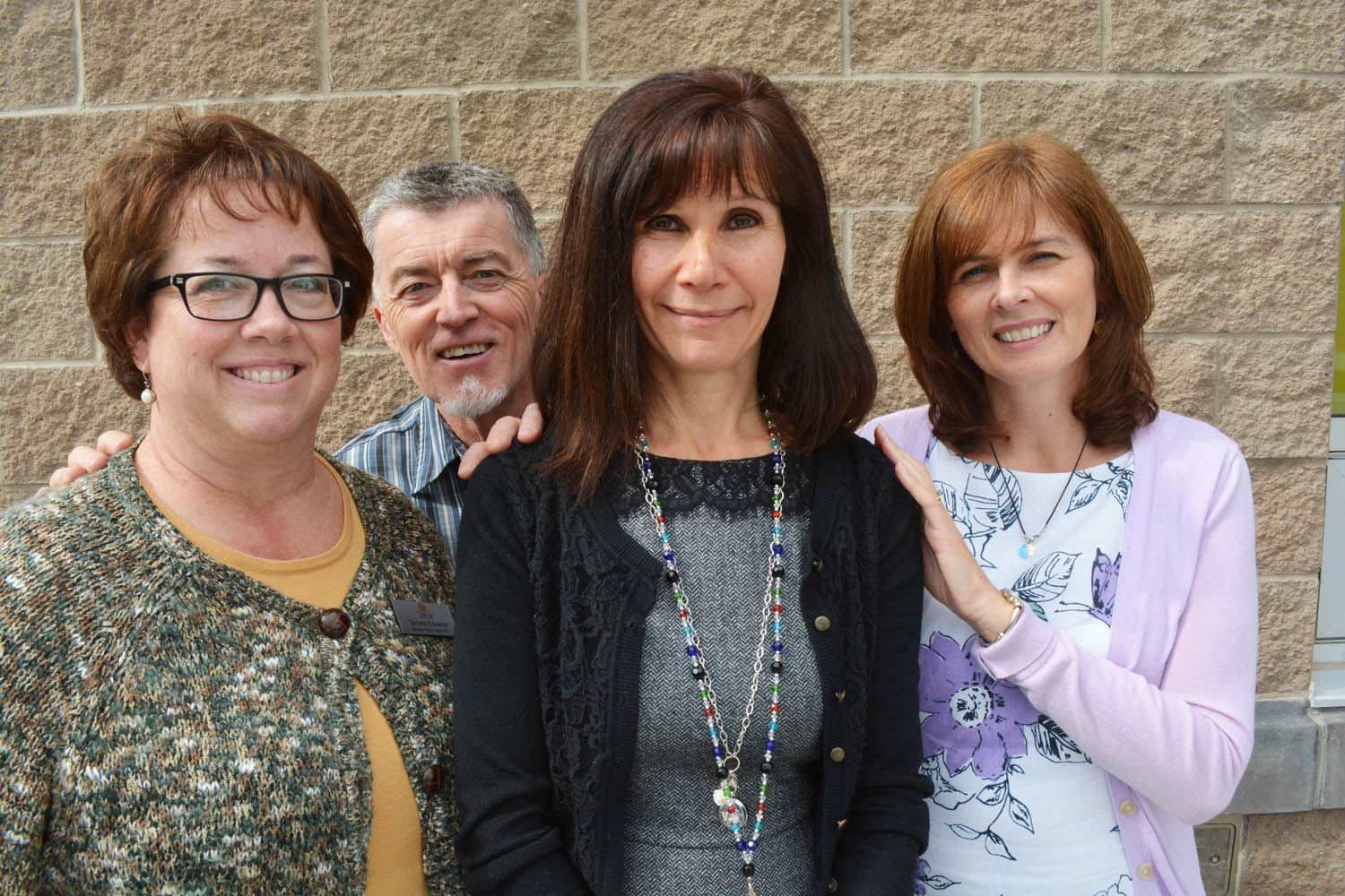 Staff at Desert Sun Counselling and Resource Centre are saying goodbye to executive director Roxie Van Aller (middle). From left are Tamela Edwards, Paul Edwards and Jodie McDonald. After 11 years working at Desert Sun, Van Aller has accepted a position at the Kelowna Women’s Shelter. (Lyonel Doherty photo)