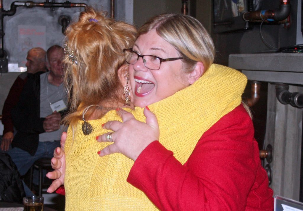 Liberal candidate Connie Denesiuk hugs a supporter. Although she was disappointed not to win the seat, she was delighted by her increase in local Liberal support as well as by the Liberal majority. (Keith Lacey photo)