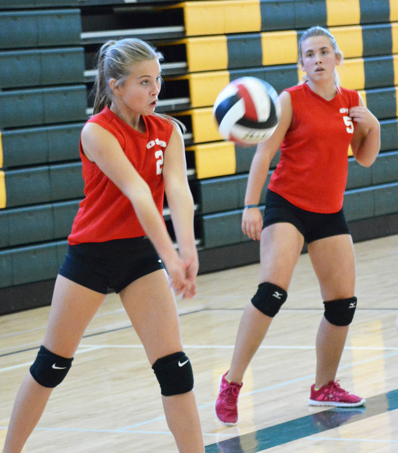 Jada Gaudet (#2) from Osoyoos Secondary School bumps the ball while teammate Alexandrea Brunner looks on during a junior girls volleyball tournament in Oliver last Friday. Osoyoos finished second in the tournament after losing to Summerland in the final. (Lyonel Doherty photo)