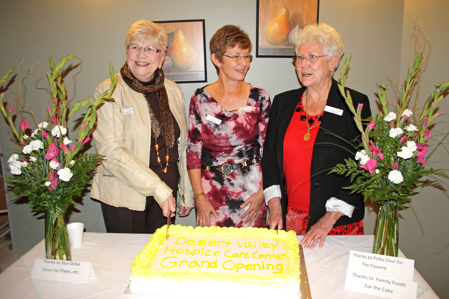 From left: Trudy Demorest, founding president of Desert Valley Hospice Society, Janet Shaw, president, and Lois Brummet, volunteer coordinator, do the ceremonial cake cutting at the official opening of the Supportive Care Centre in Osoyoos. (Keith Lacey photo)