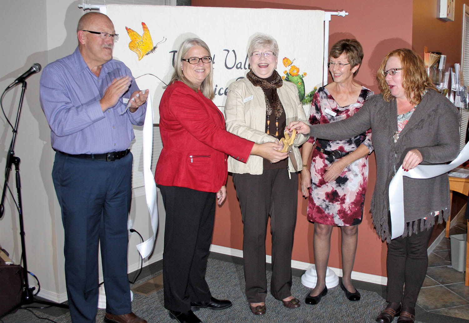 There were plenty of smiling faces when severalboard members from the Desert Valley Hospice Society officially cut the ribbon last Thursday afternoon to officially open its new Supportive Care Centre on Jonagold Place in Osoyoos. On hand for the special occasion were (from left) board member Ted Cronmiller, Ann Howard from BC Housing, Trudy Demorest, the founding president of DVHS and a honorary life member, current president Janet Shaw and Colleen Misner, constituency assistant for local MLA Linda Larson, who was unable to attend. (Keith Lacey photo)