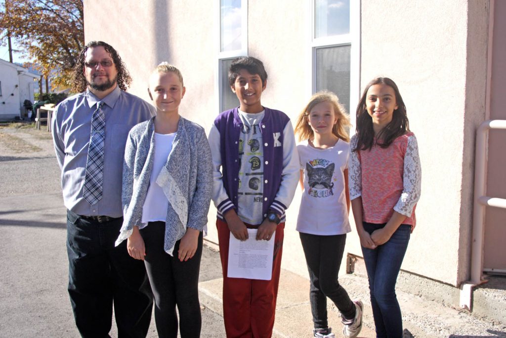 Veteran Osoyoos Elementary School teacher Richard Bayliss and four of his students made an impressive presentation to Town of Osoyoos council on Monday discussing their excitement about the upcoming We Day Celebrations in Vancouver. A total of 13 students and three chaperones will be attending the rally along with 20,000 other school children across the province on Nov. 3 at the Rogers Centre in downtown Vancouver. The students who presented to council include (from left) McKenna Pederson, Puneet Cheema, Alesia Dortman and Bianca Dutra. Council voted unanimously in favour of providing $1,250 and use of the town bus for two days for the upcoming trip to Vancouver. (Keith Lacey photo)