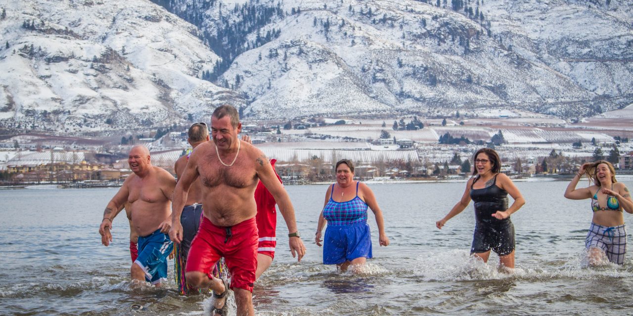Swimmers take icy New Year’s Day dip