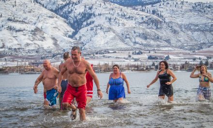 Swimmers take icy New Year’s Day dip
