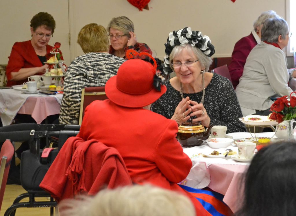 Friends share a laugh at the Osoyoos Senior Centre’s Valentine’s Day High Tea on Feb. 14. (Trevor Nichols photo)