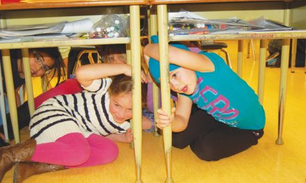 Students duck under desks during ‘ShakeOut’