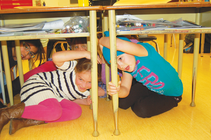 Students duck under desks during ‘ShakeOut’