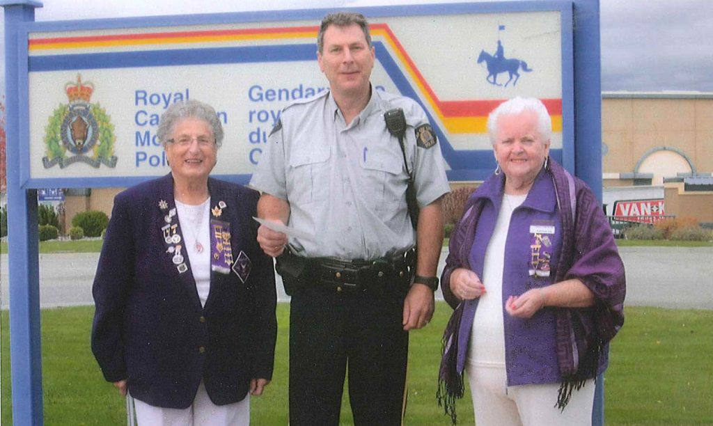 One of the many services that the Osoyoos branch of Canadian Royal Purple support is the Drug Abuse Resistance Education (DARE) program, which is the most widely delivered youth drug prevention program in B.C. The Canadian Royal Purple Lodge in Osoyoos recently presented a cheque for support of the DARE program in Osoyoos. Presenting the cheque to Const. Bruce Stangl is Royal Lady Anne Stappler (left) and Rose-Anne Sole, secretary of Osoyoos Lodge No. 240. (Photo supplied)