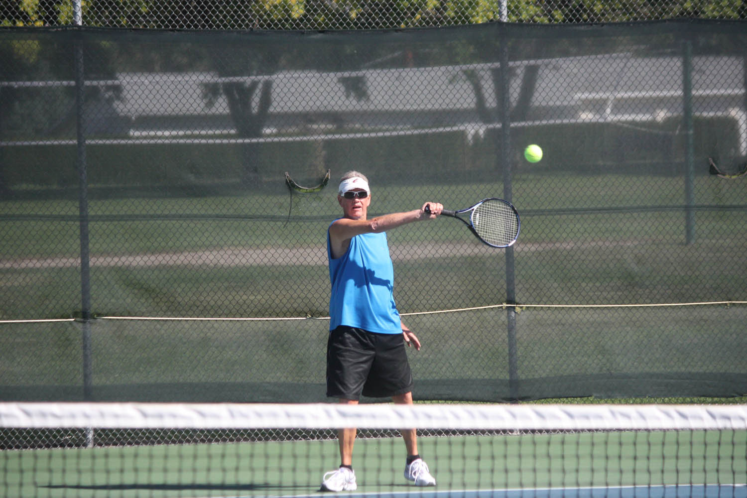 Since moving to Osoyoos five years ago to retire, Paul Kinsman has spent a great deal of his free time playing tennis as a member of the Oliver Tennis Club. Kinsman was honoured with a special award for sportsmanship, goodwill and promoting the game of tennis by the club during a stop in the action during the sixth annual Oliver Tennis Club Mixed Doubles tournament this past Saturday. Kinsman plays five or six days a week, sometimes twice a day, from April or May until the club closes in late September or early October. (Keith Lacey photo)