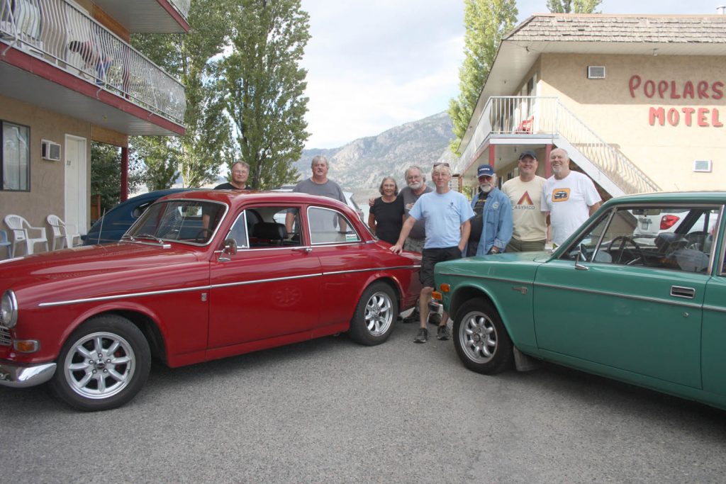 Gregg Morris (centre with sunglasses resting on his forehead) is the president of the Volvo Club of B.C. Morris and several other members made the trip to Osoyoos from Vancouver last week to show off their cars and tour the South Okanagan. Morris has never owned any other model of car but a Volvo and estimates he’s owned close to 300 over the past several decades. (Keith Lacey photo)