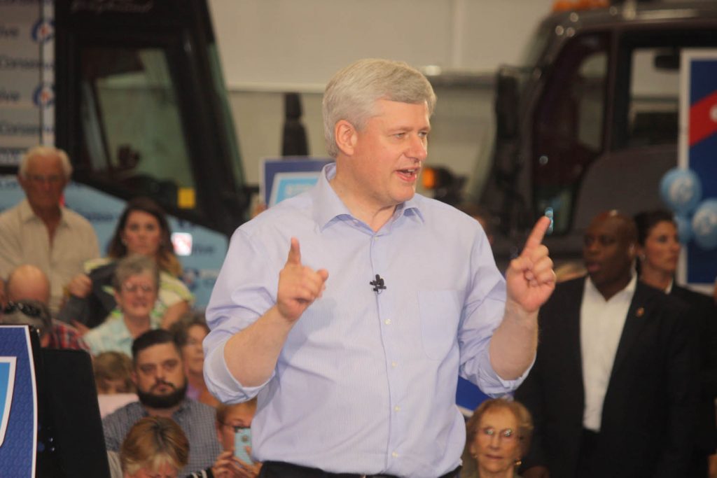 Prime Minister and Conservative Leader Stephen Harper made a pit stop in Penticton Sunday to address an invitation-only rally of supporters. He took no questions from media or attendees. His main message was that the other two major parties would bring economic disaster, while only Conservatives can be relied on to protect the economy in these uncertain times. (Keith Lacey photo)