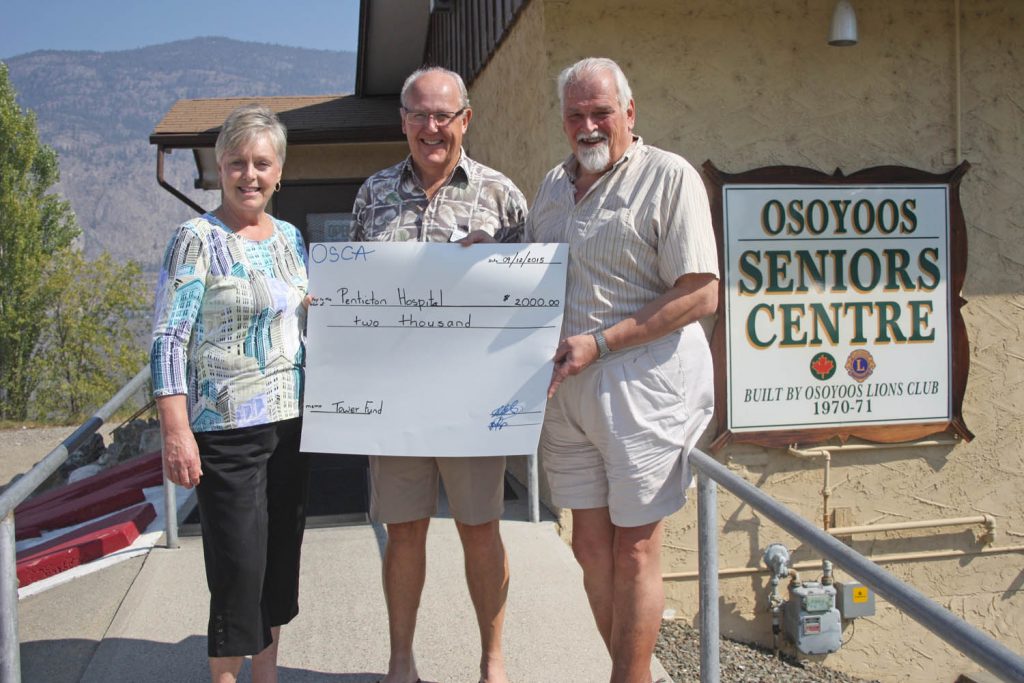 The Osoyoos Seniors Centre held its annual volunteer appreciation barbecue luncheon this past Saturday. Close to 40 volunteer members with the seniors centre attended the event, which was designed by the board of directors as a small gesture to thank the volunteers for all of their hard work and effort throughout the year. The luncheon also helped raise $2,000 for the South Okanagan-Similkameen Medical Foundation, which is raising funds to pay for equipment as part of the $325-million expansion of the Penticton Regional Hospital. Construction on that project is set to begin next year. Above, Osoyoos Mayor Sue McKortoff and Osoyoos Seniors Centre board president Dennis Goodridge (right) present a cheque to Peter Steele, a board member with the medical foundation, who lives in Osoyoos. (Keith Lacey photo)