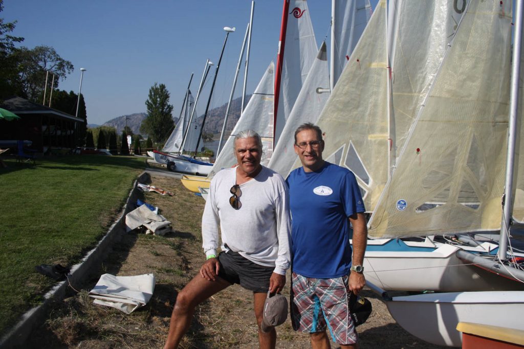 Pierre Forland (left) and Dr. Chris Scheuren, commodore with the Osoyoos Sailing Club, are excited about this Sunday’s event that will see dozens of local members participate in Bart’s Bash. The event has been recognized by the Guinness World Book of Records as the largest-participating sailing event in the world. Local residents are also invited to participate in the event. (Keith Lacey photo)