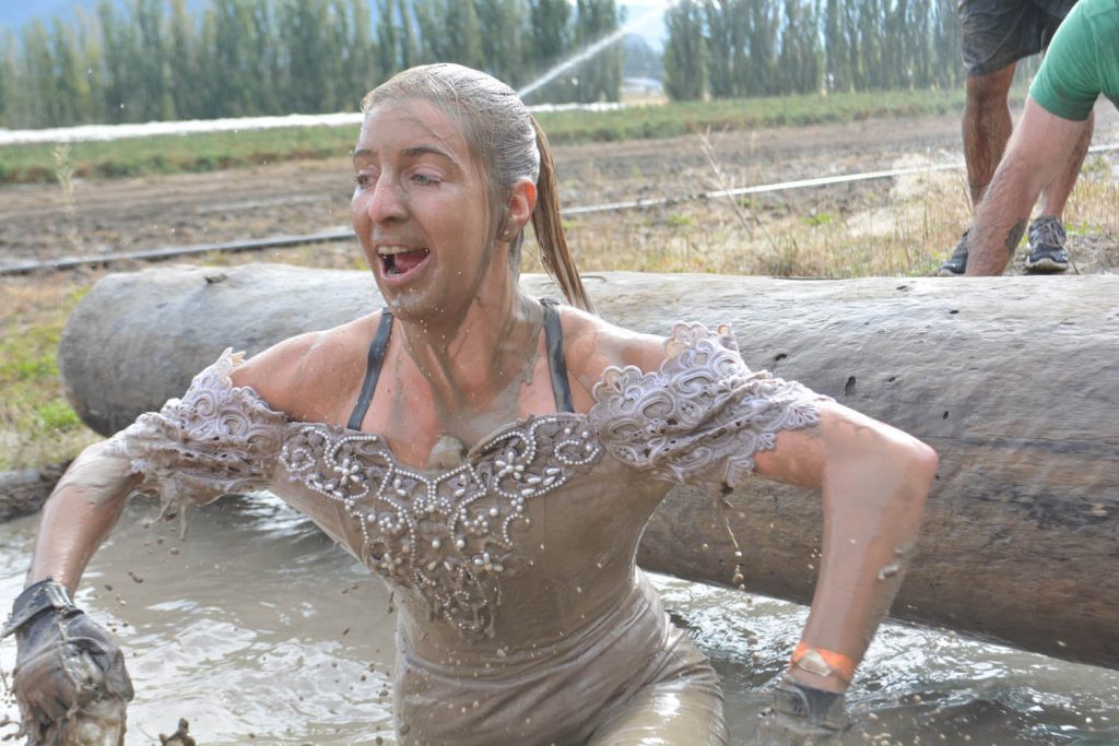 The Freak’n Farmer adventure race at Covert Farms was a blast for the 700-plus participants who tackled the obstacles with gusto on Saturday. Here, Brooke Sproule, from Winfield, comes up for air after diving in a pool of mud while wearing a bridal gown. (Lyonel Doherty photo)