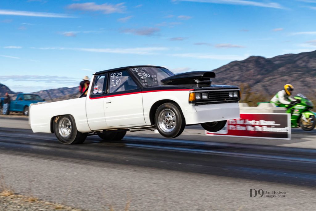 Peachland's Phil Walter lofts the front end of his '86 Nissan truck off the start line at Richter Pass Motorplex in Osoyoos, BC. Walter and his opponent, Warren Brown ('02 Kawasaki are a well-matched set as two of the fastest vehicles on Osoyoos' tarmac. (Dan Hodson photo)
