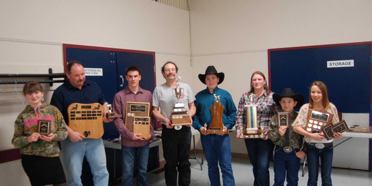 Sportsmen and ladies bag trophies at dinner
