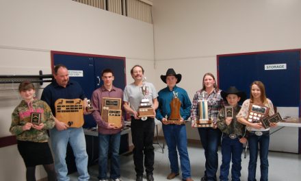 Sportsmen and ladies bag trophies at dinner