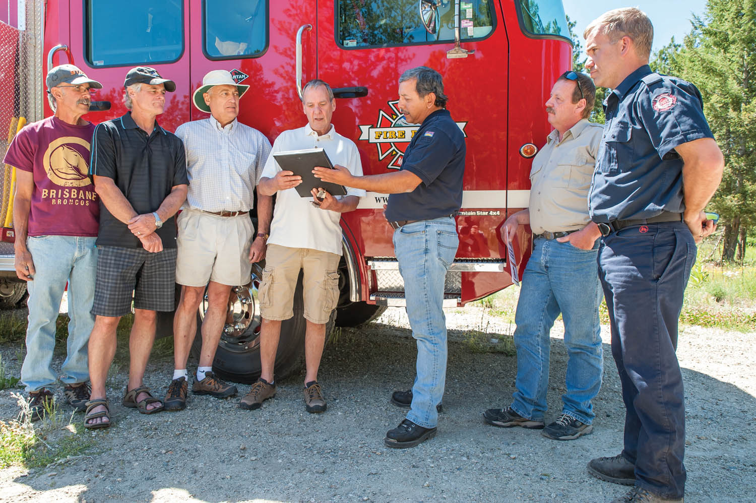 Thomas Blank (third from right), FireSmart Canada B.C. Liaison, presented a certificate last July to Chuck Harrison of Anarchist Mountain's FireSmart committee in this file photo. Also pictured from left are committee members Walter Zinowki, Denis Thomson and Richard Douziech. Looking on at right are Peter Hisch, superintendant of fuels management at the B.C. Wildfire Management Branch and Darren Hutchinson, captain with Anarchist Mountain Fire Department. The certificate recognizes the progress Anarchist Mountain has made towards becoming a FireSmart Canada community. (Richard McGuire file photo)