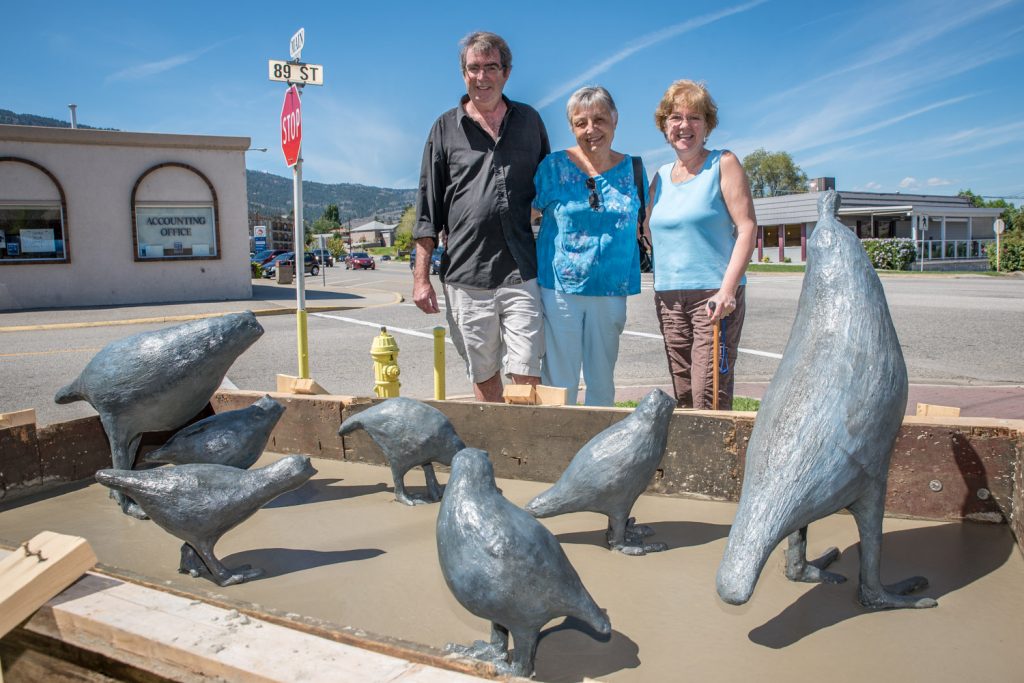 Artists (from left) Peter Scott, Toni Ramsay and Deb Sherwin admire the newly placed quail sculptures they made for the front of the Osoyoos Art Gallery. They placed them with help from Rick Holz and Kirk Hood of CSI Contract. (Richard McGuire photo)