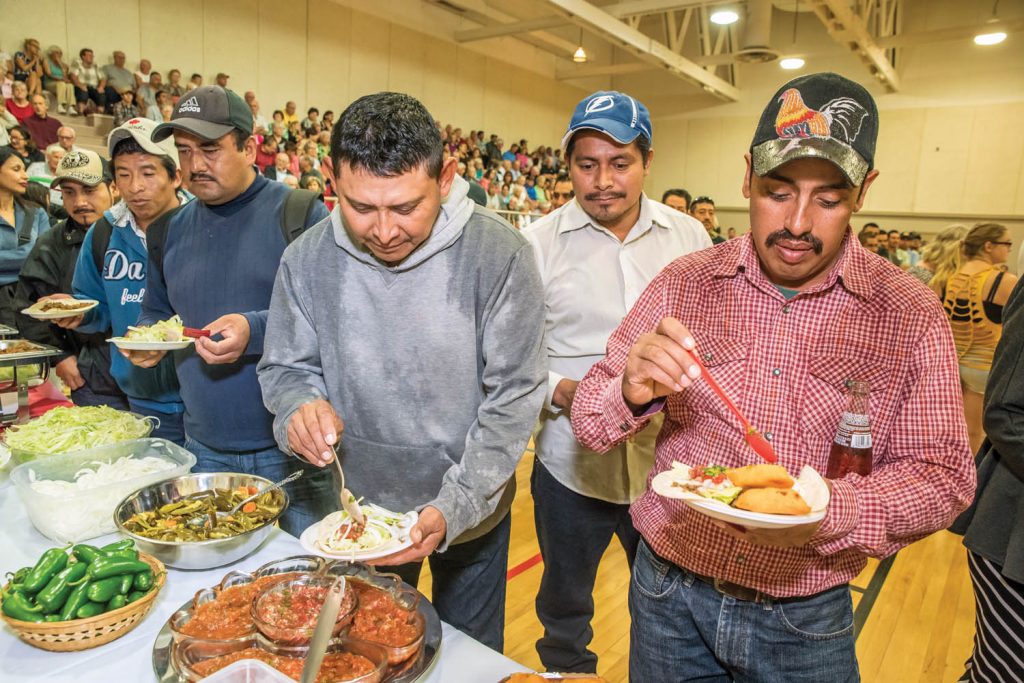 Mexican workers and local residents lined up for traditional tacos at Mexican Appreciation Day in August. (Richard McGuire file photo)