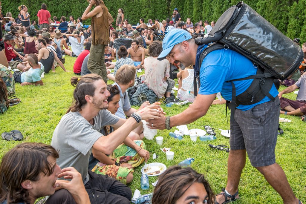 Byron Carpenter (right), of Mountain Park Community Church in Abbotsford, carried a pack filled with lemonade on his back to serve to migrants. Gratefully accepting a drink is Damian Escalante Peterson of Mexico City. (Richard McGuire photo)