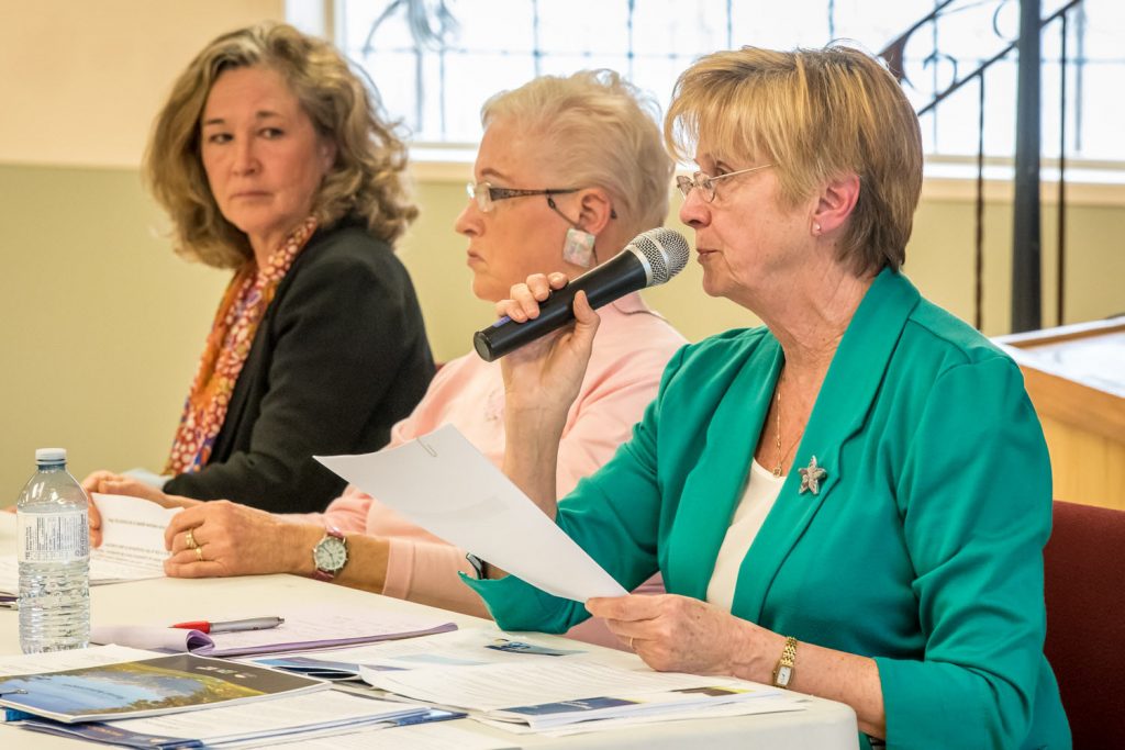 From left: Colleen Ross, NDP candidate; Cheryl Halsted, moderator; and Linda Larson, B.C. Liberal candidate and incumbent MLA. (Richard McGuire photo)