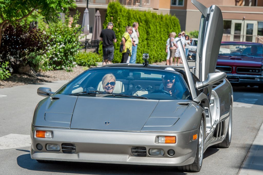 Roberto Giannini sets out in his Lamborghini Diablo VT Roadster, which was just one of the high-powered, high-priced cars setting out from Spirit Ridge Saturday in the Area 27 Rally. (Richard McGuire photo)