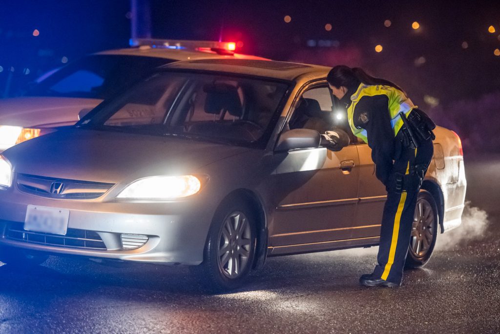 Constable Jody Rausch speaks to a driver during a CounterAttack road check on Hwy. 3 on Saturday evening. Osoyoos RCMP were on the lookout for impaired drivers, but they didn't encounter any. (Richard McGuire photo)